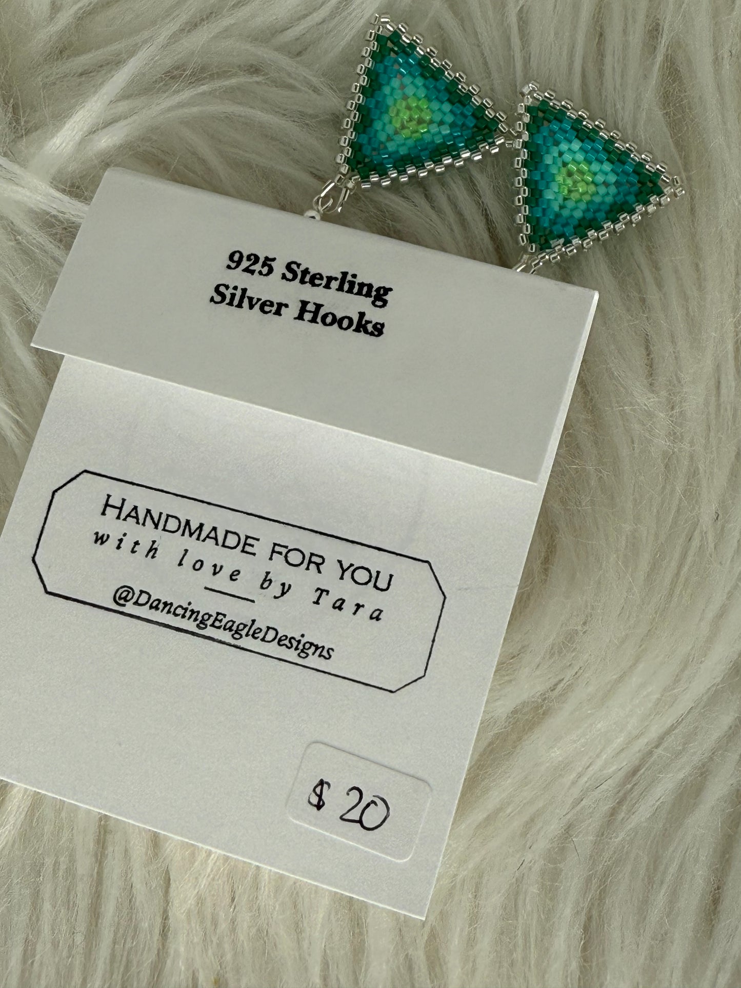 Small beaded triangle earrings in shades of green with silver trim