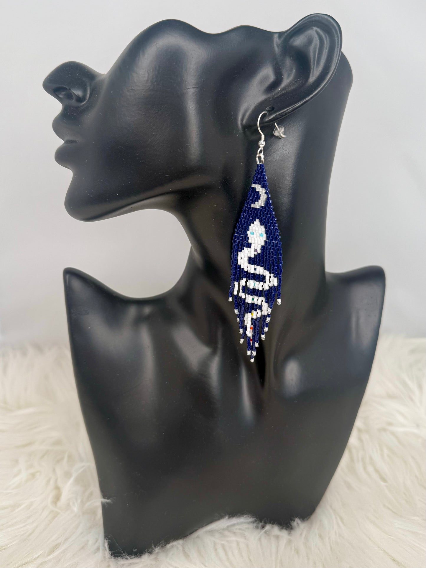 Beaded dark navy blue fringe earrings with white and rainbow snake with blue eyes and crescent waxing moon