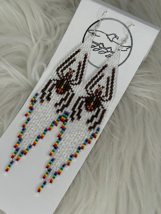 Longer Beaded white fringe earrings with brown spider and rainbow tips